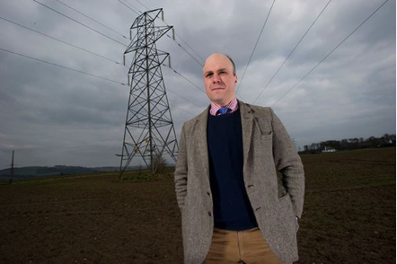Man standing with powerlines in the background