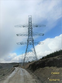 A three-directional metal transmission tower.
