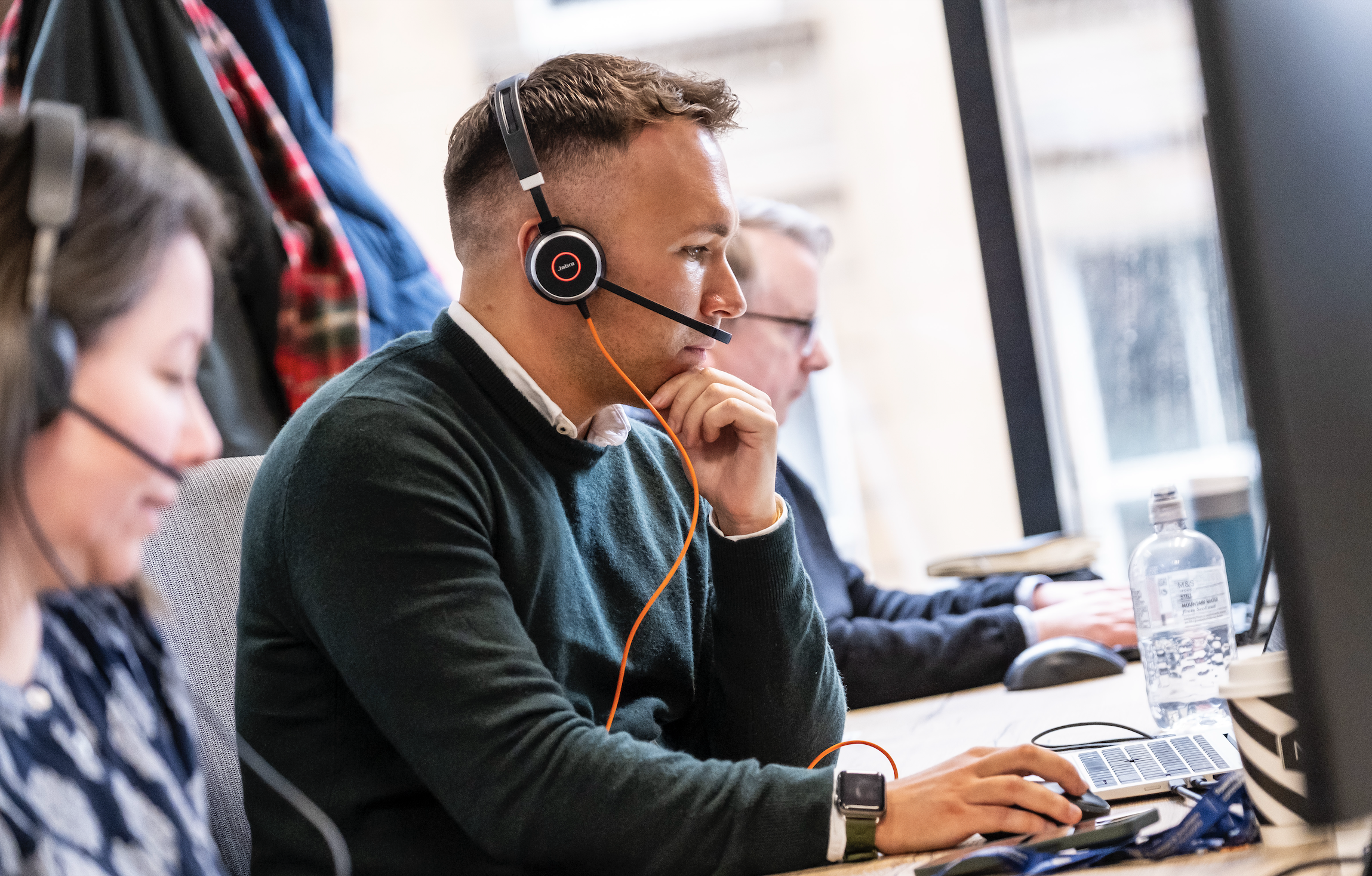An employee is communicating with customers