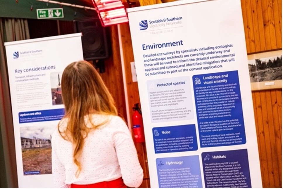 Stakeholder looking at some information boards.