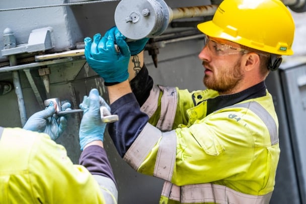 Transmission workers carrying out works on transformer.