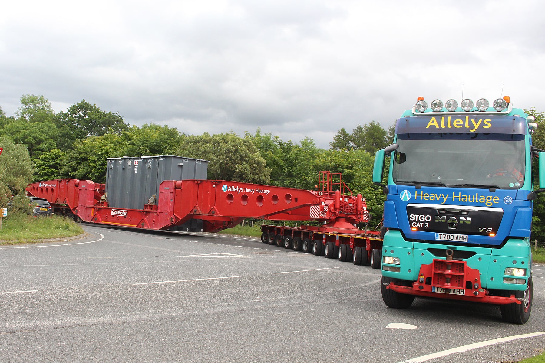 Asset Container being transported through back roads.