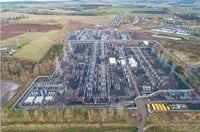 An aerial view of a substation with sections under construction.