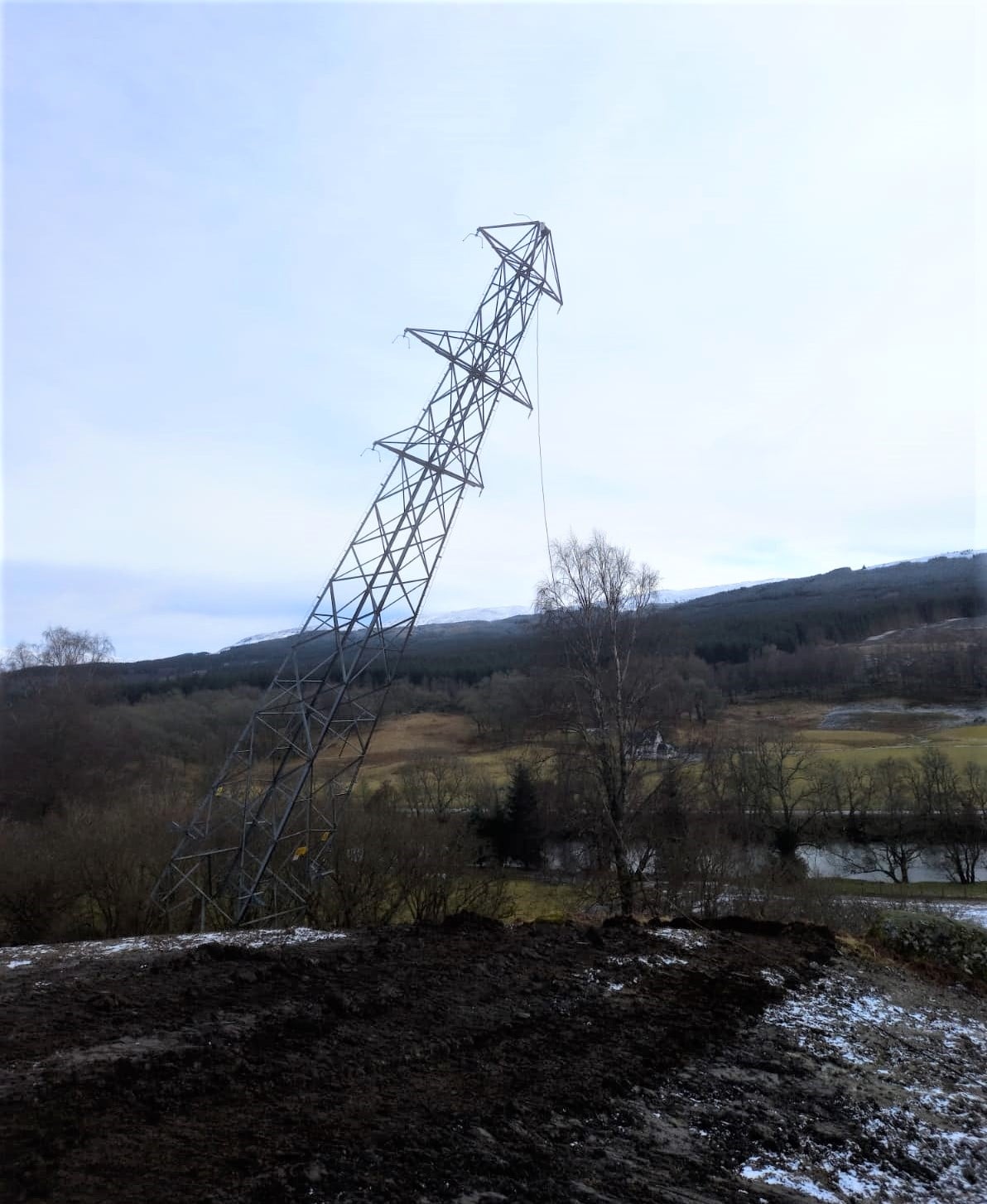 First tower felled in Killin VISTA project A metal transmission tower partway through falling.
