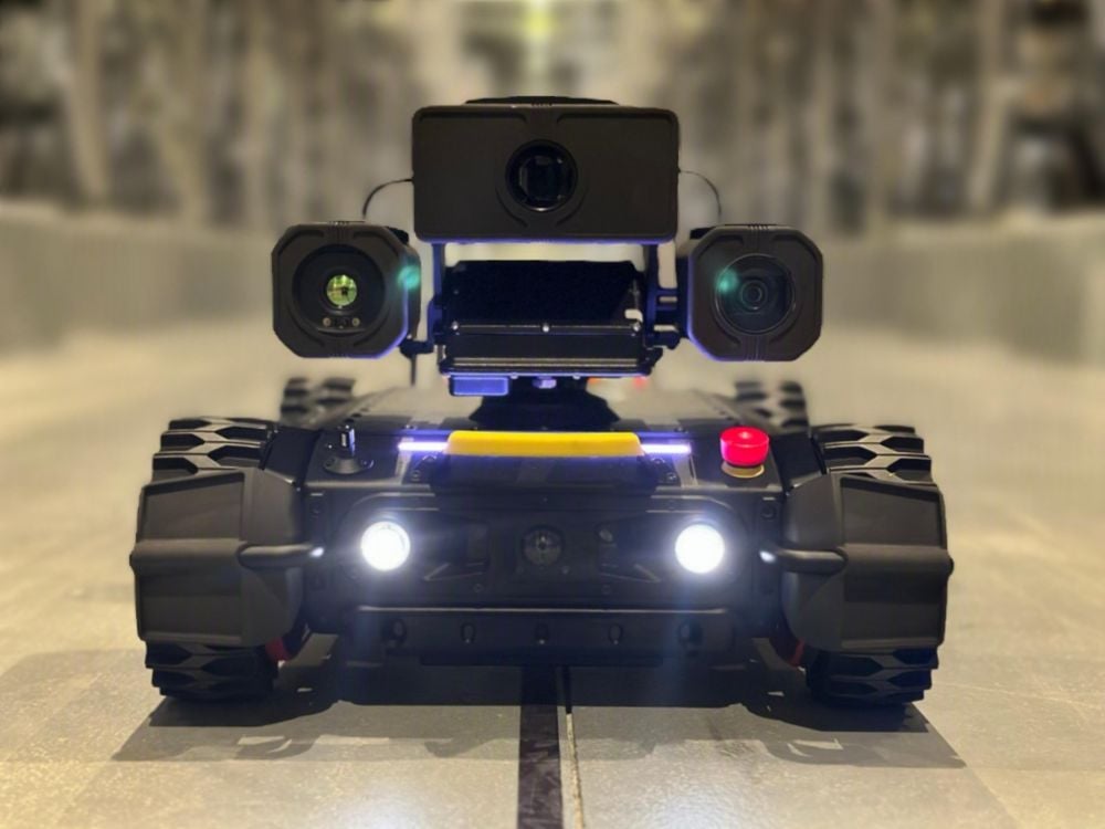 A photograph of a small inspection robot within one of our stations
