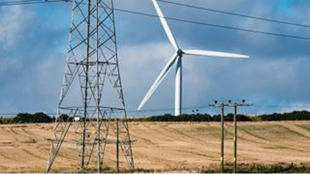 Powerlines with windmills in the background