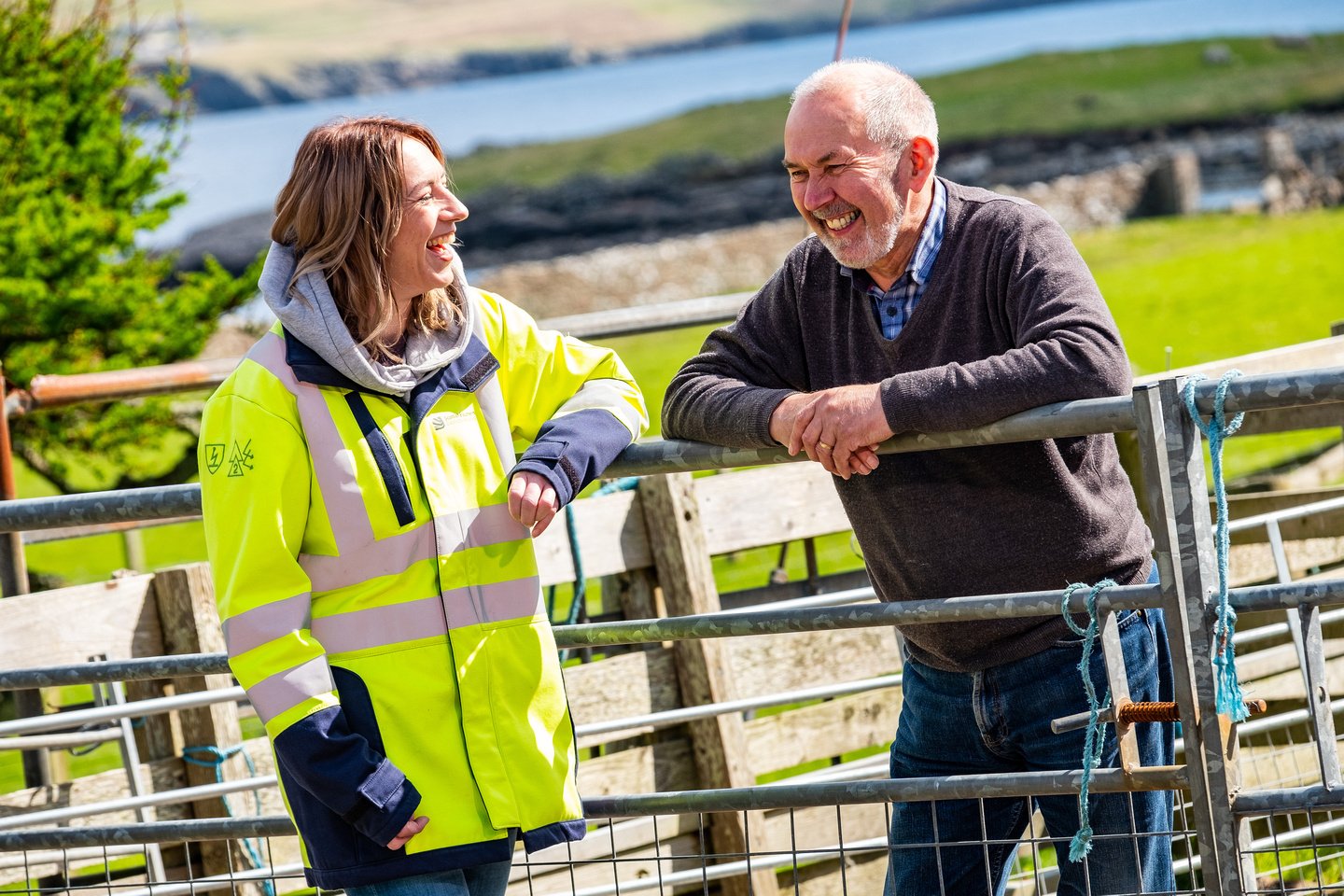 Sharon Powell, based in Shetland, is speaking with one of her stakeholders by a fence