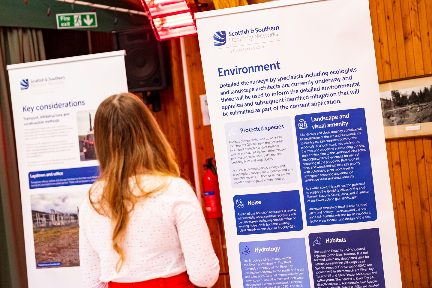 Member of the public reviewing project information boards at an event