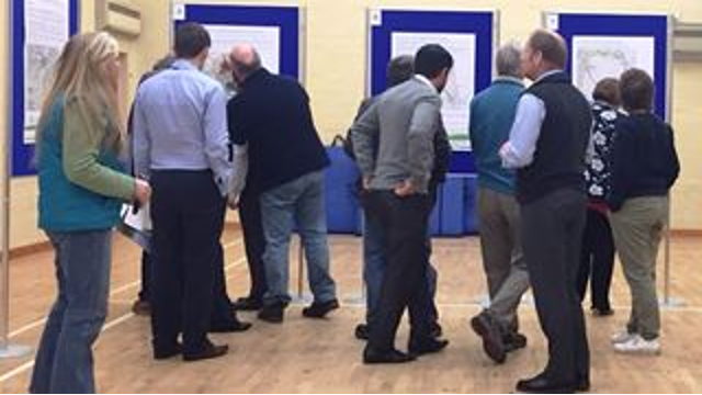 SSEN Transmission employees and members of the public examining project posters.