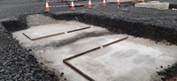 Concrete laid in an excavated area.