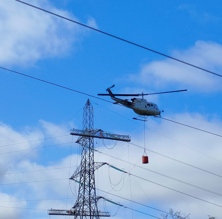 Helicopter near tower.