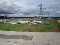 Metal structures rested on blocks on a construction site.