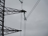 LT162-attaching-conductors-to-middle-arm-on-temporary-tower-t2.jpg