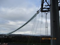 An insulating section attached to a metal tower. A date in the corner reads "2021/11/02 12:04".