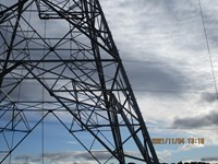 A close up view of the mid-section of a metal transmission tower. A date in the corner reads "2021/11/04 13:18".