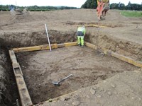 Worker carrying out foundation works.