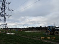 Tractor in front of tower.