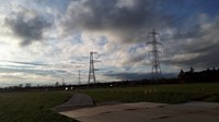 Metal transmission towers forming an overhead line.