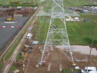 An aerial view of a metal transmission tower. A date in the corner reads "2021/11/03 11:20".