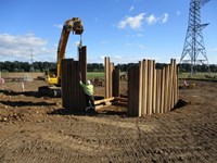 Metal sections forming a wall surrounding an area.