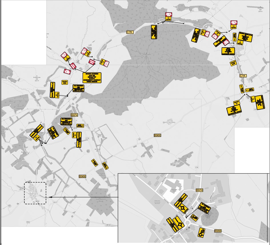 A greyscale map showing yellow and red roadsigns clustered around sections of roads.