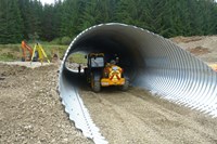 heavy machinery traveling through metal containment. 