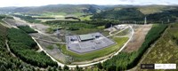 An aerial view of a substation surrounded by hills and forest. A logo in the corner states "CYBERHAWK".