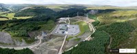 An aerial view of a substation surrounded by hills and forest. A logo in the corner states "CYBERHAWK".