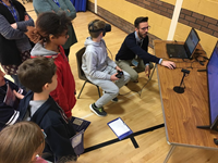 Primary school aged children using Virtual Reality equipment.
