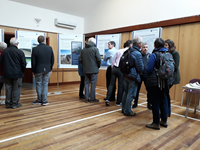 Members of the public with SSEN Transmission staff in front of project posters.