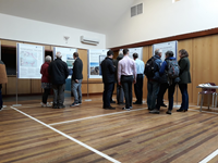 Members of the public with SSEN Transmission staff in front of project posters.