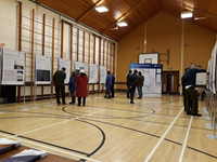 Members of the public with SSEN Transmission staff in front of project posters.