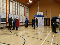 Members of the public with SSEN Transmission staff in front of project posters.