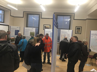 Members of the public with SSEN Transmission staff in front of project posters.