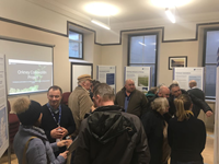 Members of the public with SSEN Transmission staff in front of project posters.