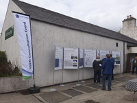 Members of the public with SSEN Transmission staff in front of project posters.