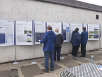 Members of the public with SSEN Transmission staff in front of project posters.