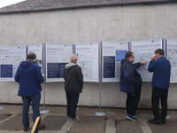 Members of the public with SSEN Transmission staff in front of project posters.