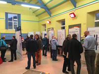 Members of the public with SSEN Transmission staff in front of project posters.