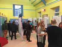 Members of the public with SSEN Transmission staff in front of project posters.