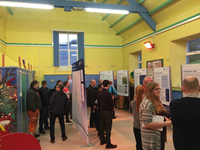 Members of the public with SSEN Transmission staff in front of project posters.