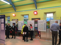 Members of the public with SSEN Transmission staff in front of project posters.