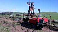 A wooden fence construction vehicle.