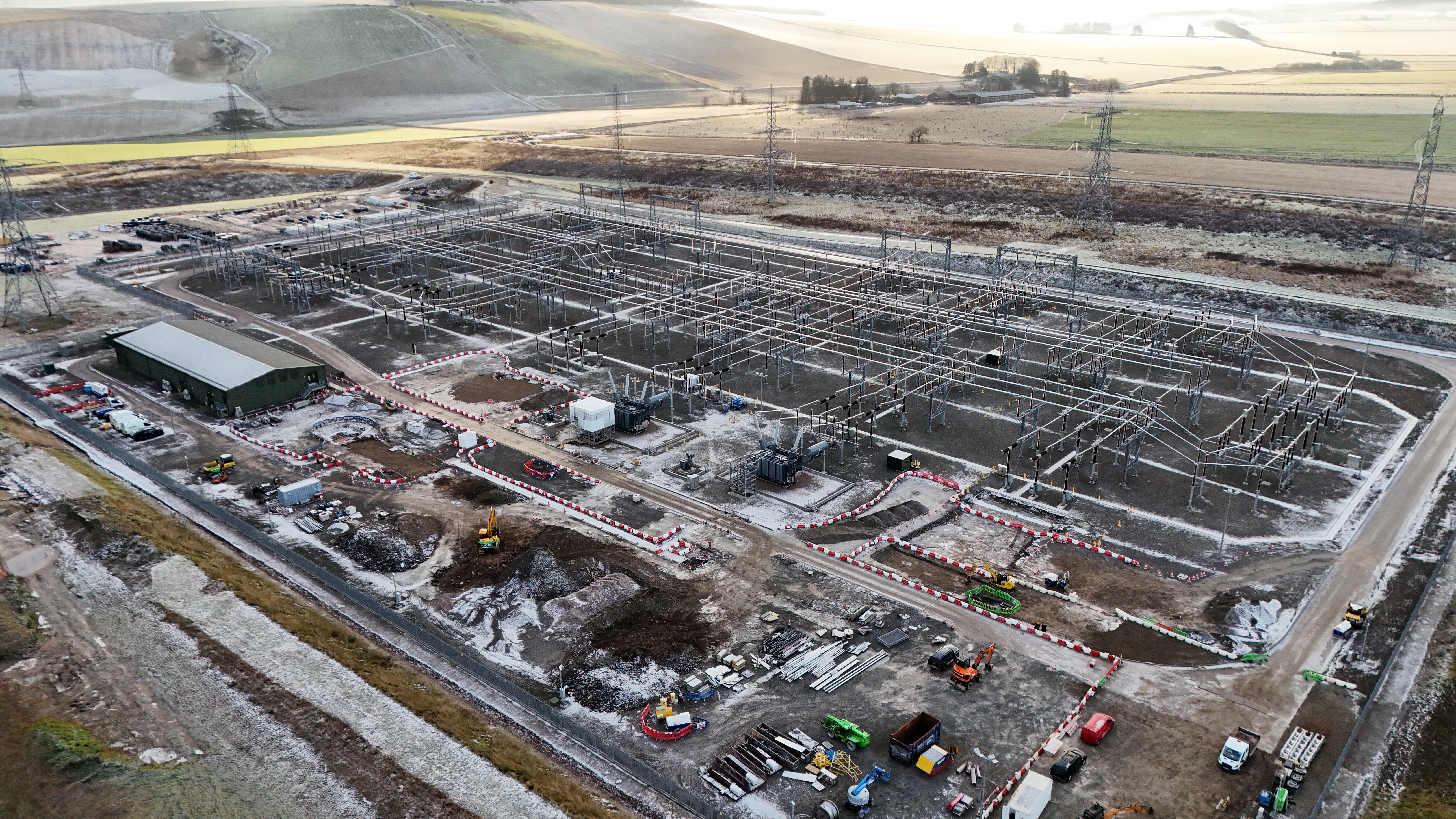 An aerial view of a substation partially under construction.