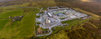 An aerial view of a substation under construction in a rural area.