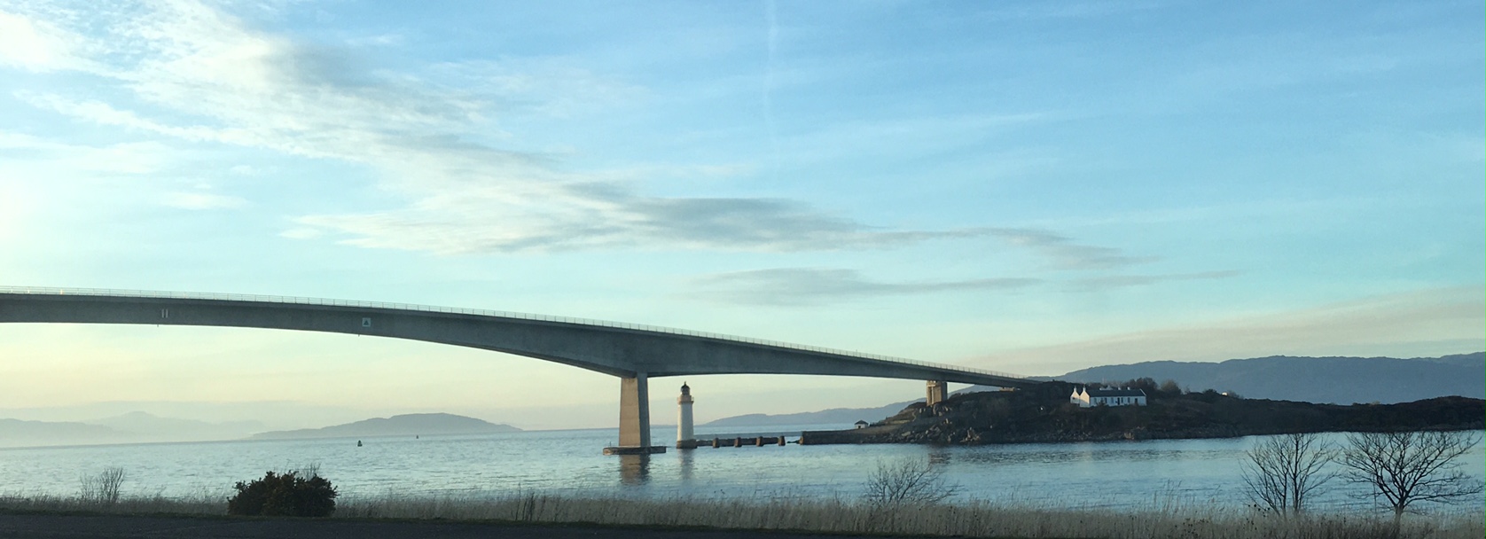 A concrete bridge over a body of water.
