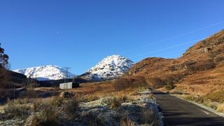 Landscape with a path and snow-capped mountains