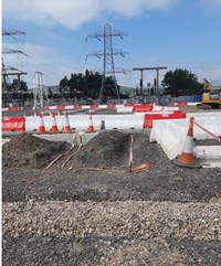 Metal strips in excavated area in a substation under construction.