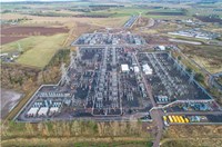 An aerial view of a substation with sections under construction.