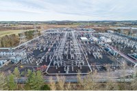 An aerial view of a substation with sections under construction.